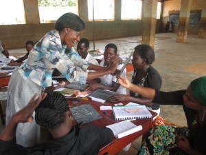 A teacher practising some of what she has learnt during a training session. 